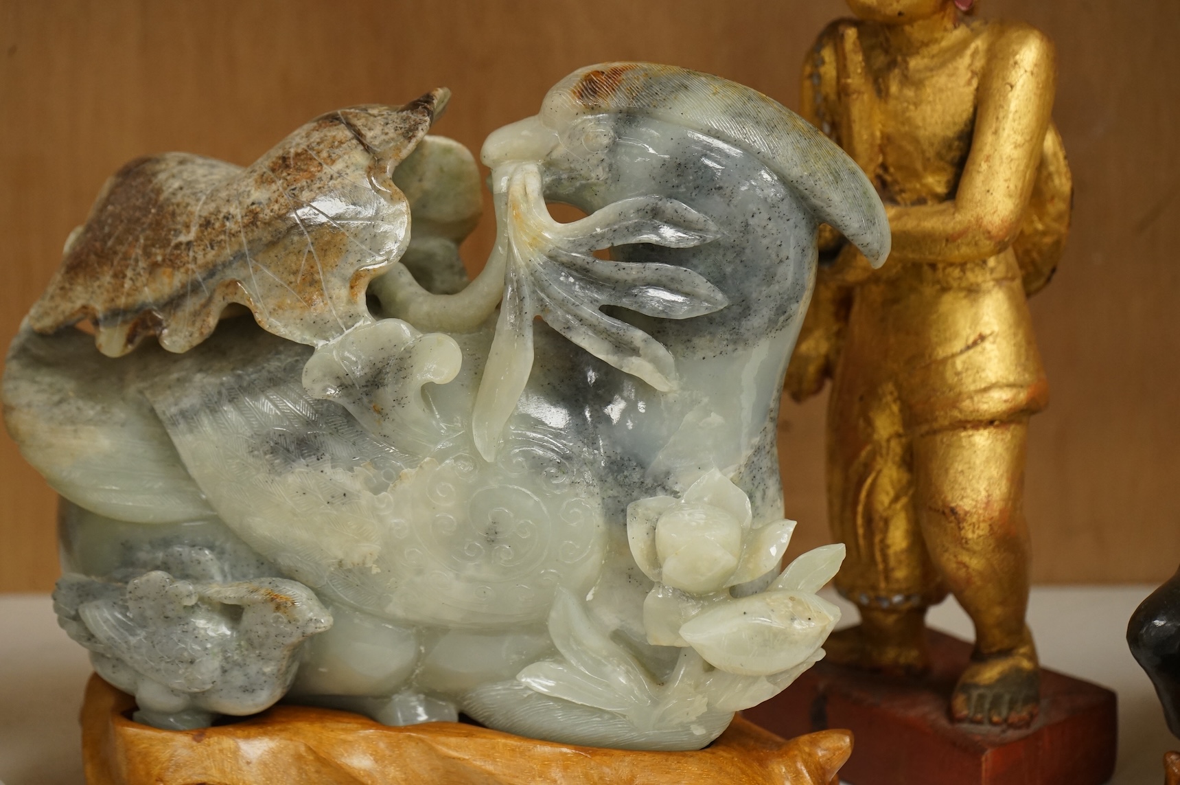 Two modern jade figures, together with a marble Buddha and a carved giltwood figure, largest 24cm wide